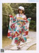 A woman in a kimono is posing for a picture.